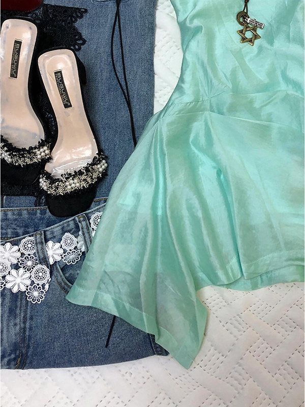 Mint green sleeveless mini dress with layered, flared irregular skirt