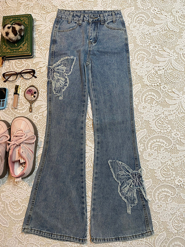 Light-blue denim flared-leg jeans with butterfly patch at the hem
