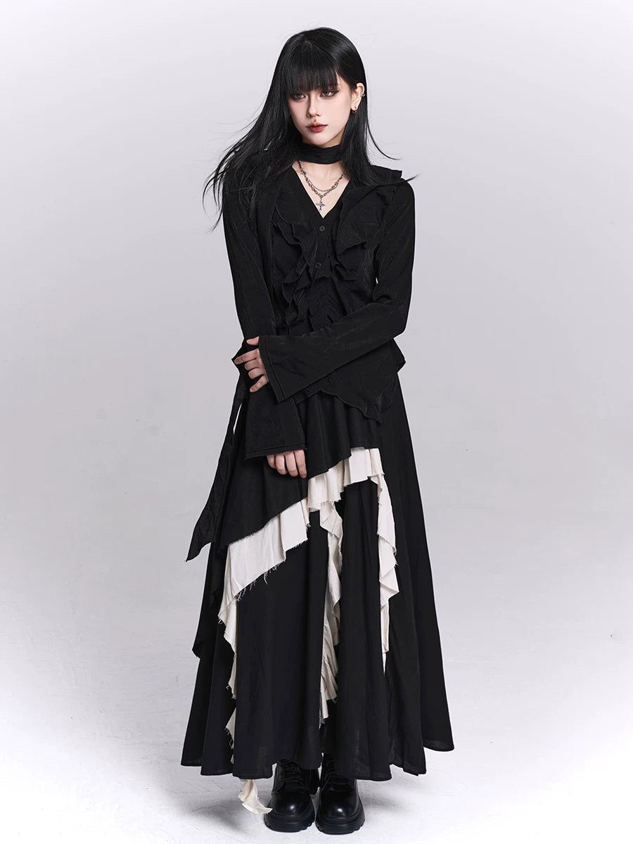 Black maxi skirt with asymmetric cascading ruffles and white contrasting sections