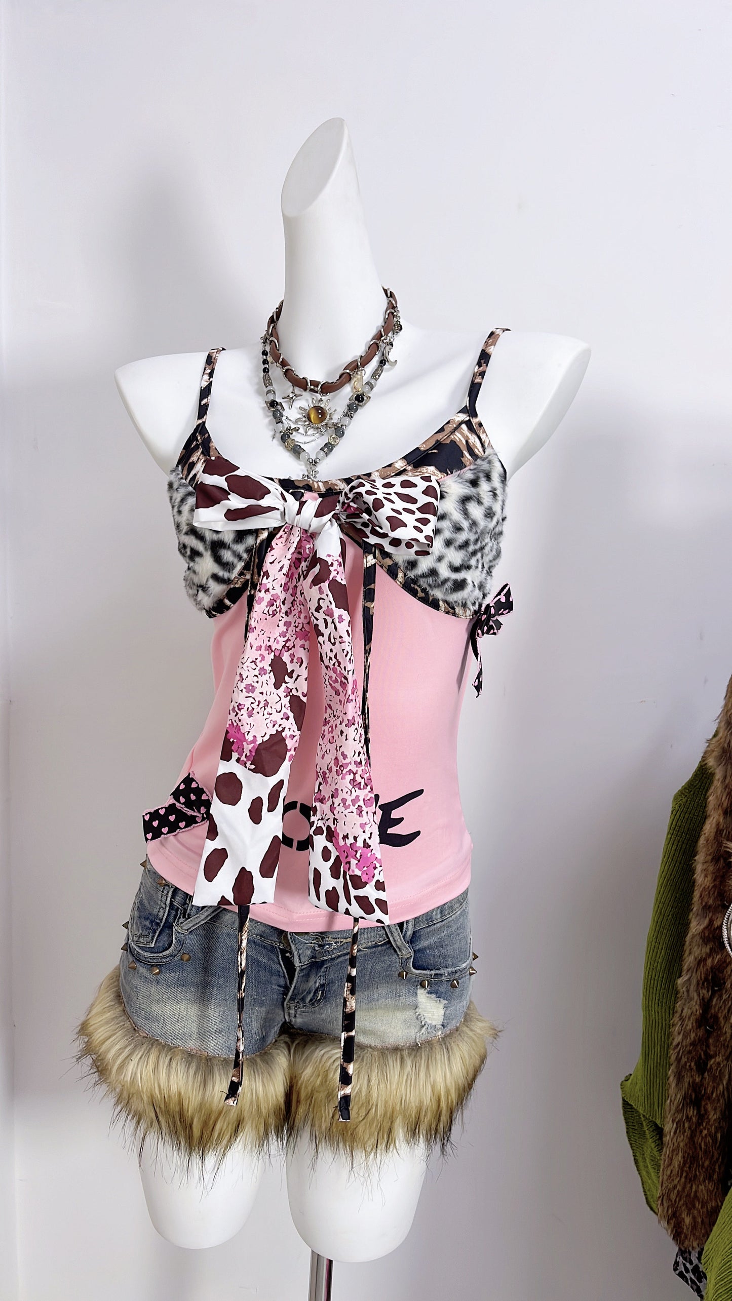 Pink patchwork camisole with leopard-print faux fur panels, front bow, and ribbon ties