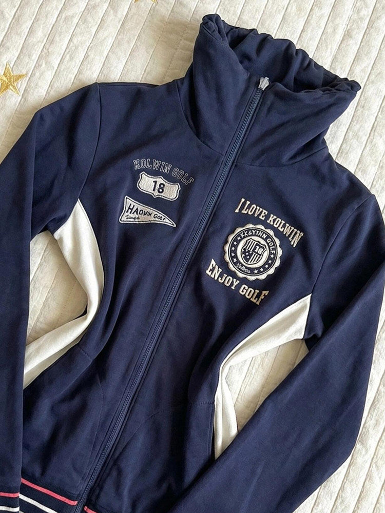 Navy stand-collar zip jacket with golf badge and text patch; white angled side panels
