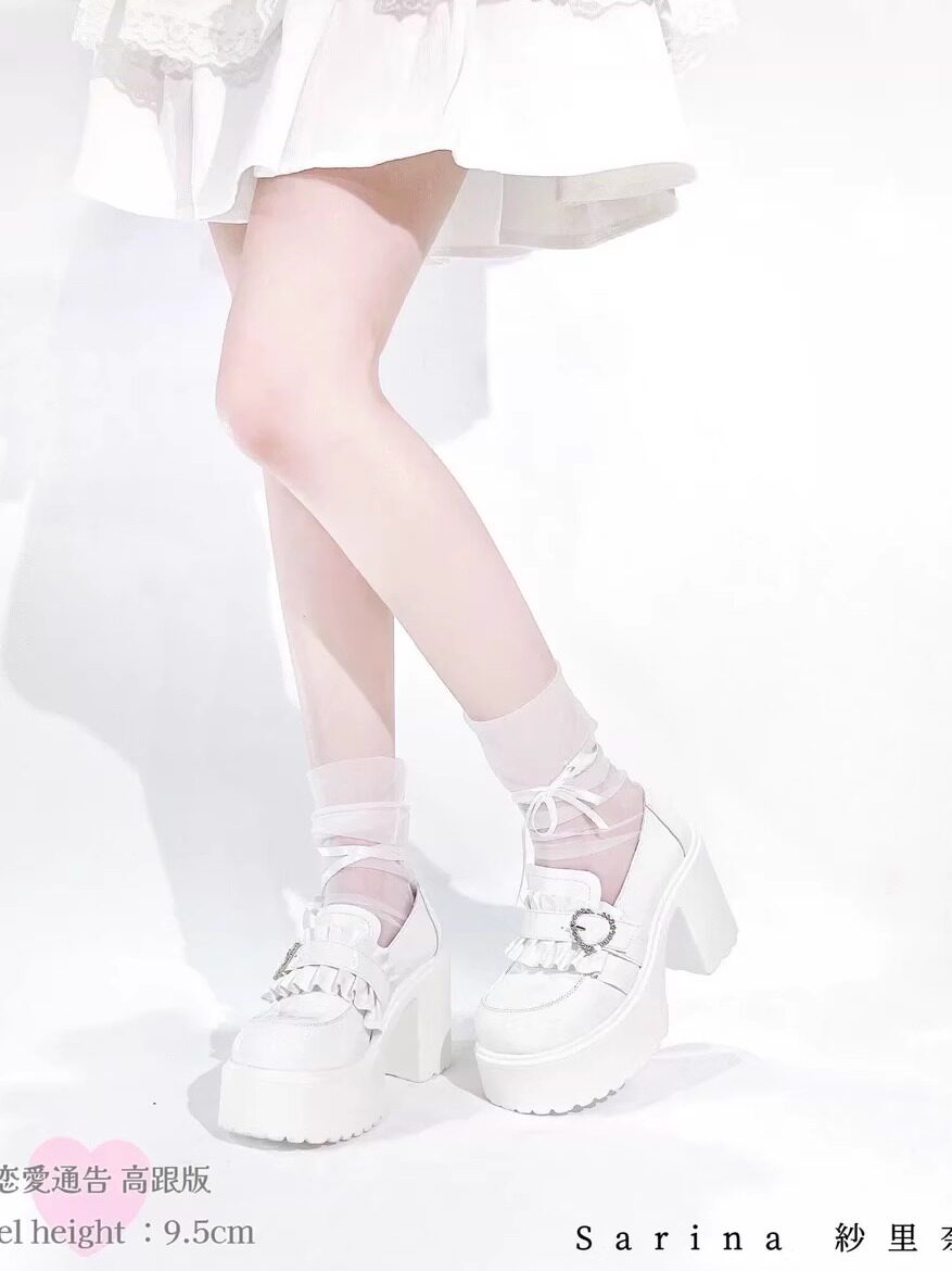 White chunky platform Mary Janes with bow straps and block heels