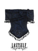 One-shoulder jacquard top with dark pattern, bow detail, and black tassel trim