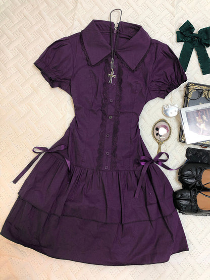 Purple lace patchwork dress with short puff sleeves, button front, and tiered skirt.