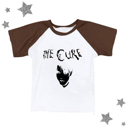 Brown and white raglan graphic tee with black The Cure logo and portrait print