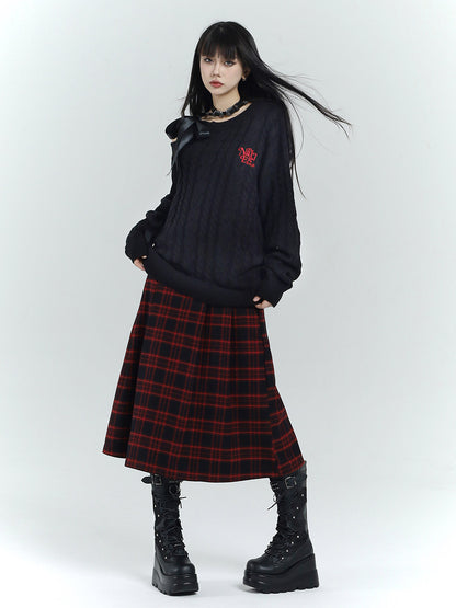 Long A-line plaid wool skirt, red and black tartan with pleated flare and side straps