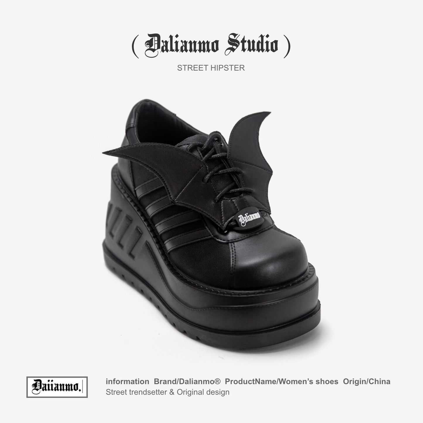 Black lace-up platform boots with winged side panels and chunky tread sole