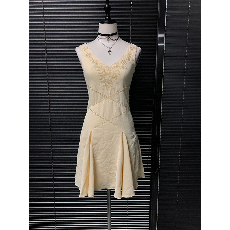 Embroidered chiffon fairy dress in light yellow with gold embroidered yoke and hem