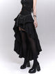 Black layered mini skirt with asymmetric ruffle tiers and draped mesh underlayer
