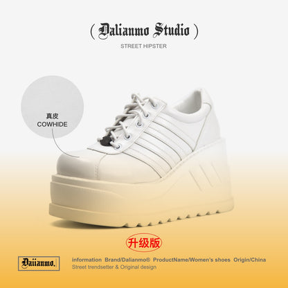 White platform lace-up sneaker with striped panels and chunky ridged sole