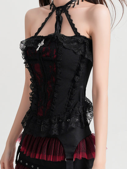 Black lace halterneck vest blouse with crisscross strap back and red pleated ruffle peeking at hem.
