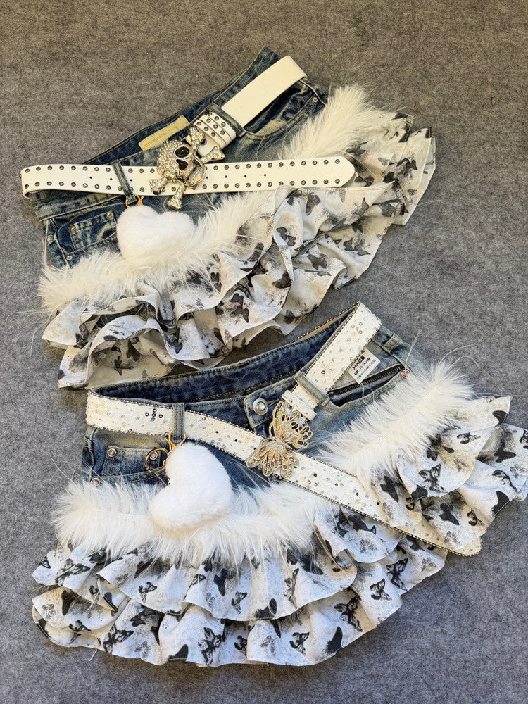 Ruffled denim skirt with butterfly print, white faux-fur trim, studded belt straps