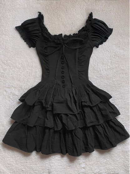 Black off-shoulder ruffle cake dress with corset-style button placket and tiered skirt