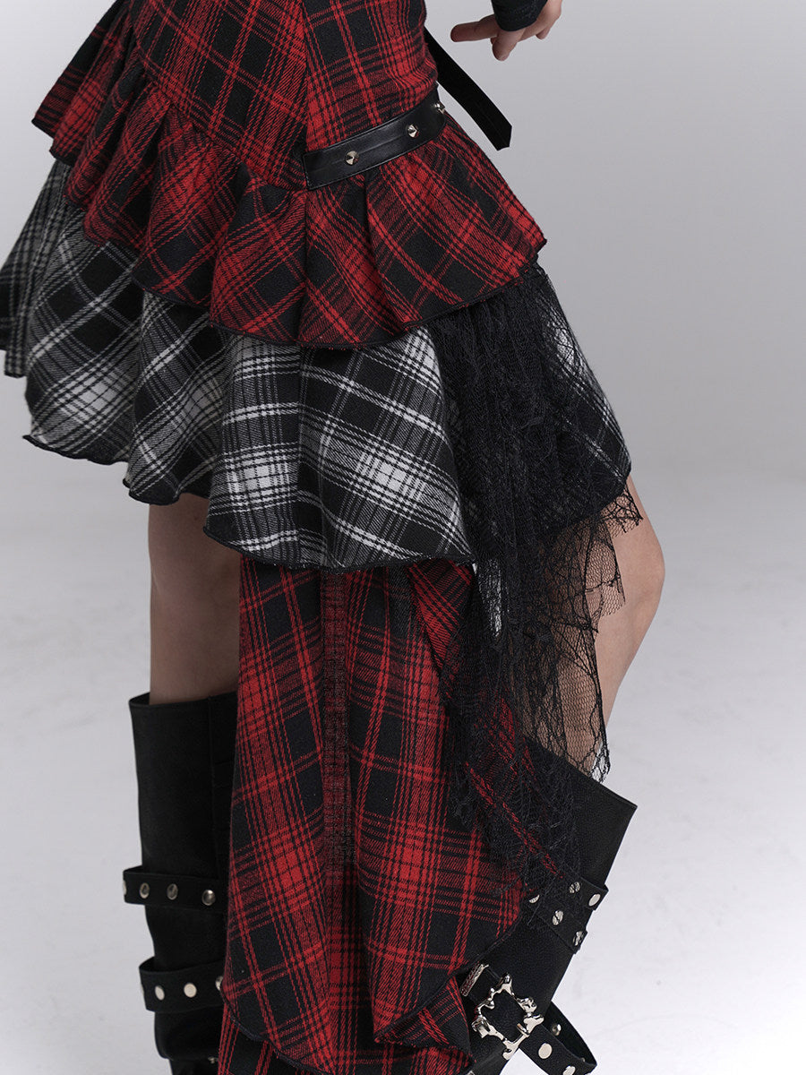 Asymmetrical plaid mini skirt detail with red-black and black-white checks and black sheer overlay