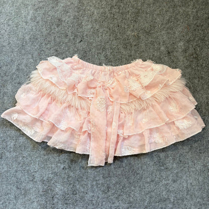 Pink puffy mini skirt with tiered lace ruffles and soft tulle-like layers