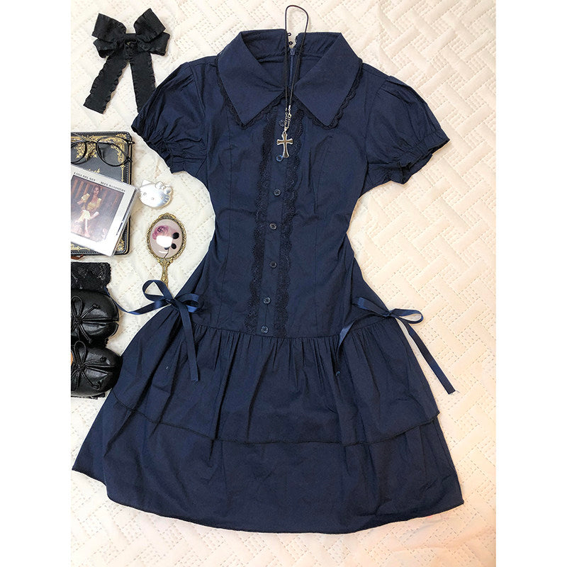 Dark blue lace patchwork dress with puff sleeves, button placket, and waist ribbon ties.