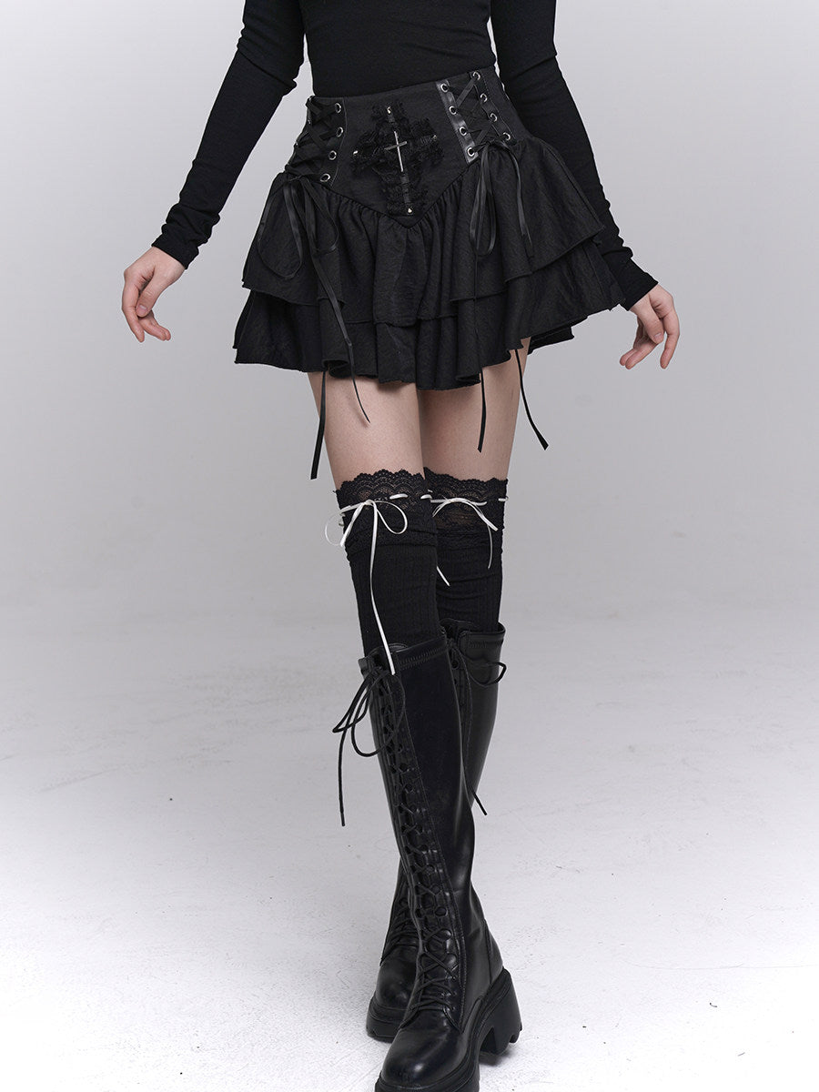 Black tiered punk skirt with corset-style lacing and cross embroidery at waistband