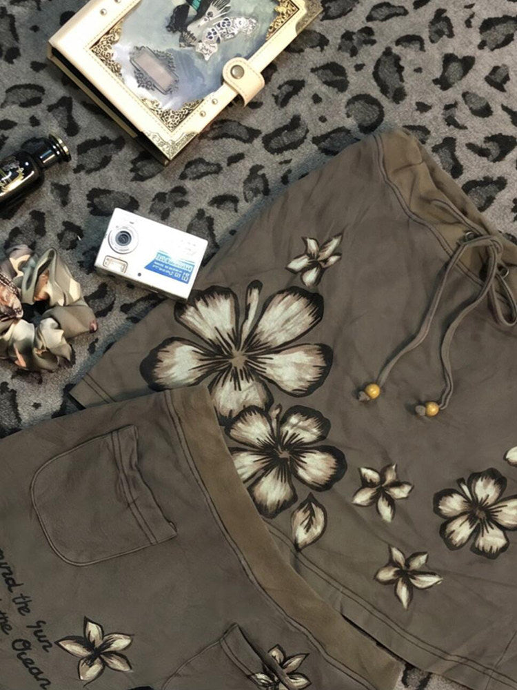 Khaki floral midi skirt with drawstring waistband and large butterfly flower print