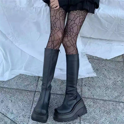 Black knee-high boots with side zip, thick platform sole and rounded toe