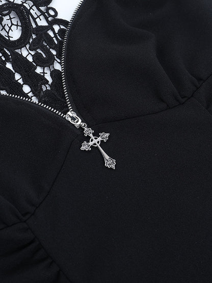 Black lace suspender vest close-up with silver zipper pull and cross charm