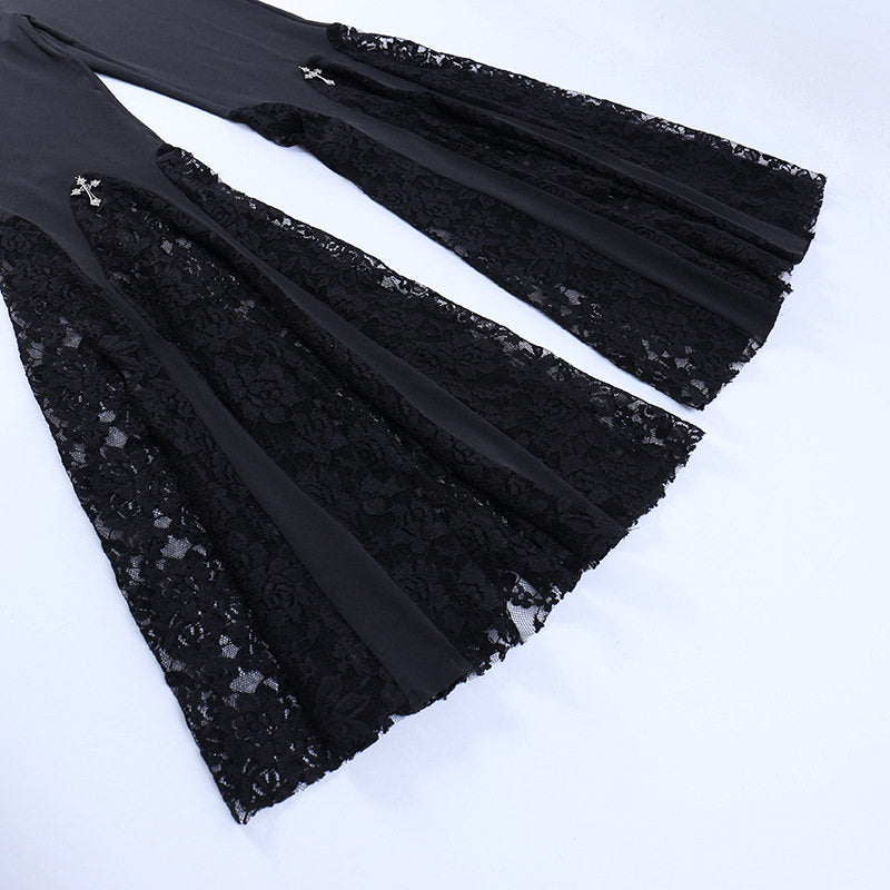 Black lace hem flares detail with floral pattern and small cross-like accents