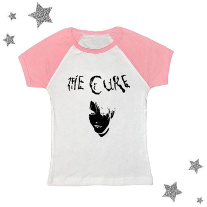 Pink and white raglan graphic tee with black The Cure logo and portrait print