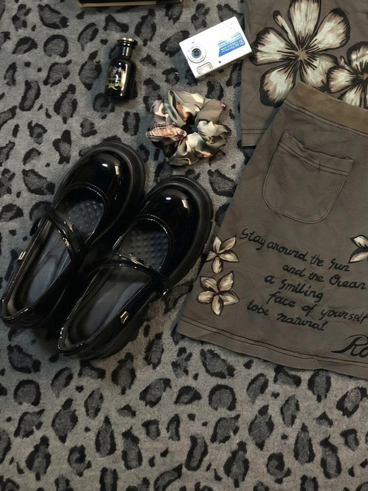 Khaki floral midi skirt with front pockets and script slogan near hem