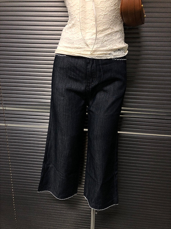Dark blue cropped flare jeans with rear yoke and scalloped hem trim