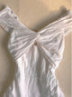 White one-shoulder short dress with tied bow neckline and gathered waist, tiered skirt