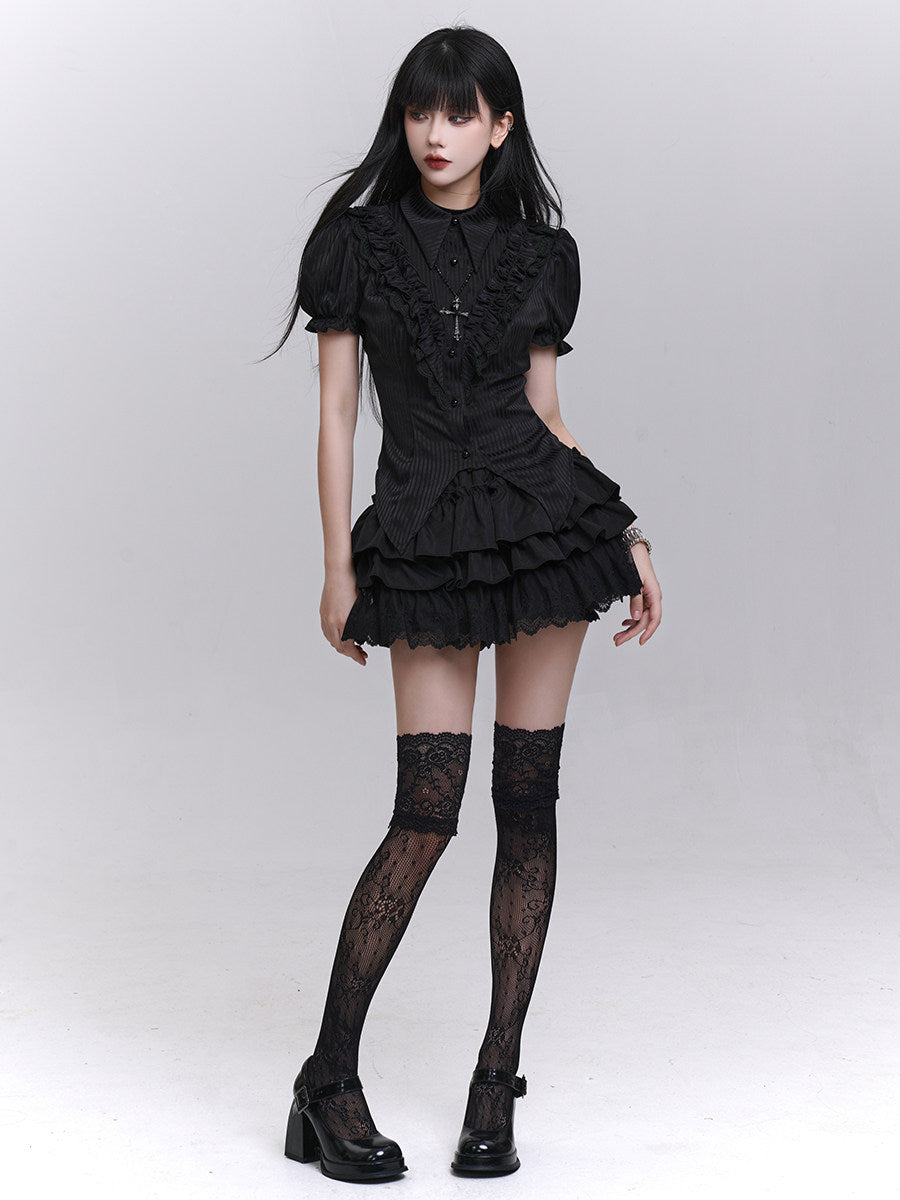 Black short-sleeved blouse with puff sleeves, button-front, and tiered ruffle hem