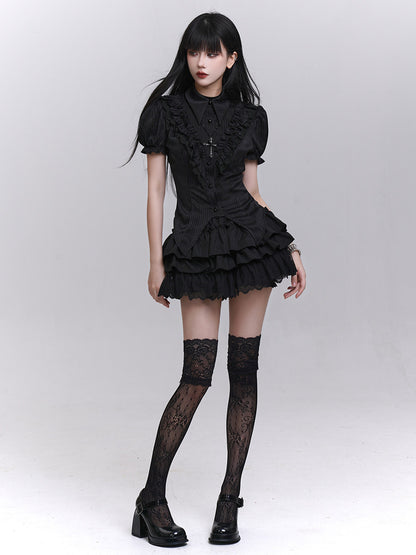 Black short-sleeved blouse with puff sleeves, button-front, and tiered ruffle hem