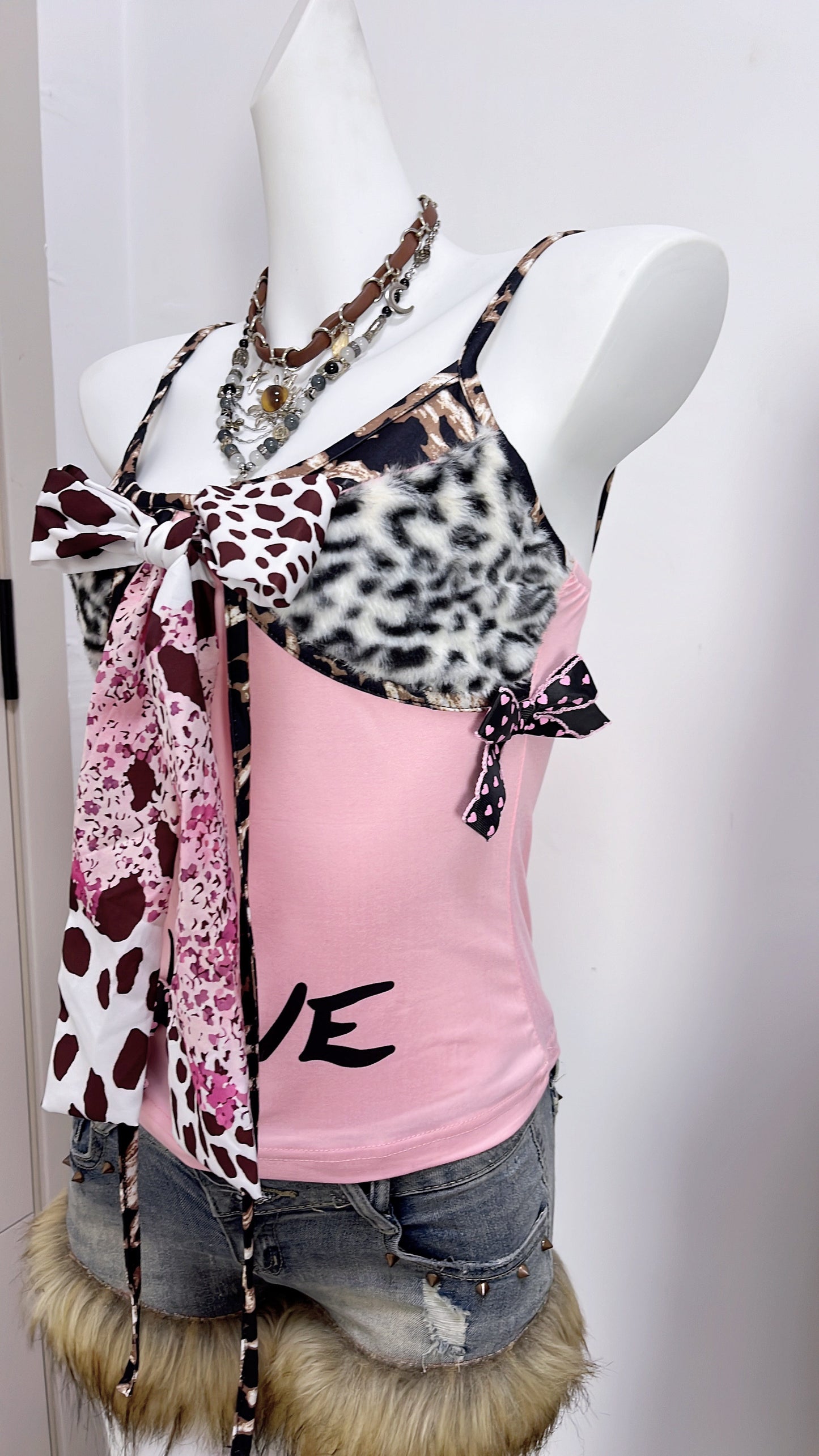 Pink patchwork camisole with leopard-print faux fur trim, front bow, and dangling ties