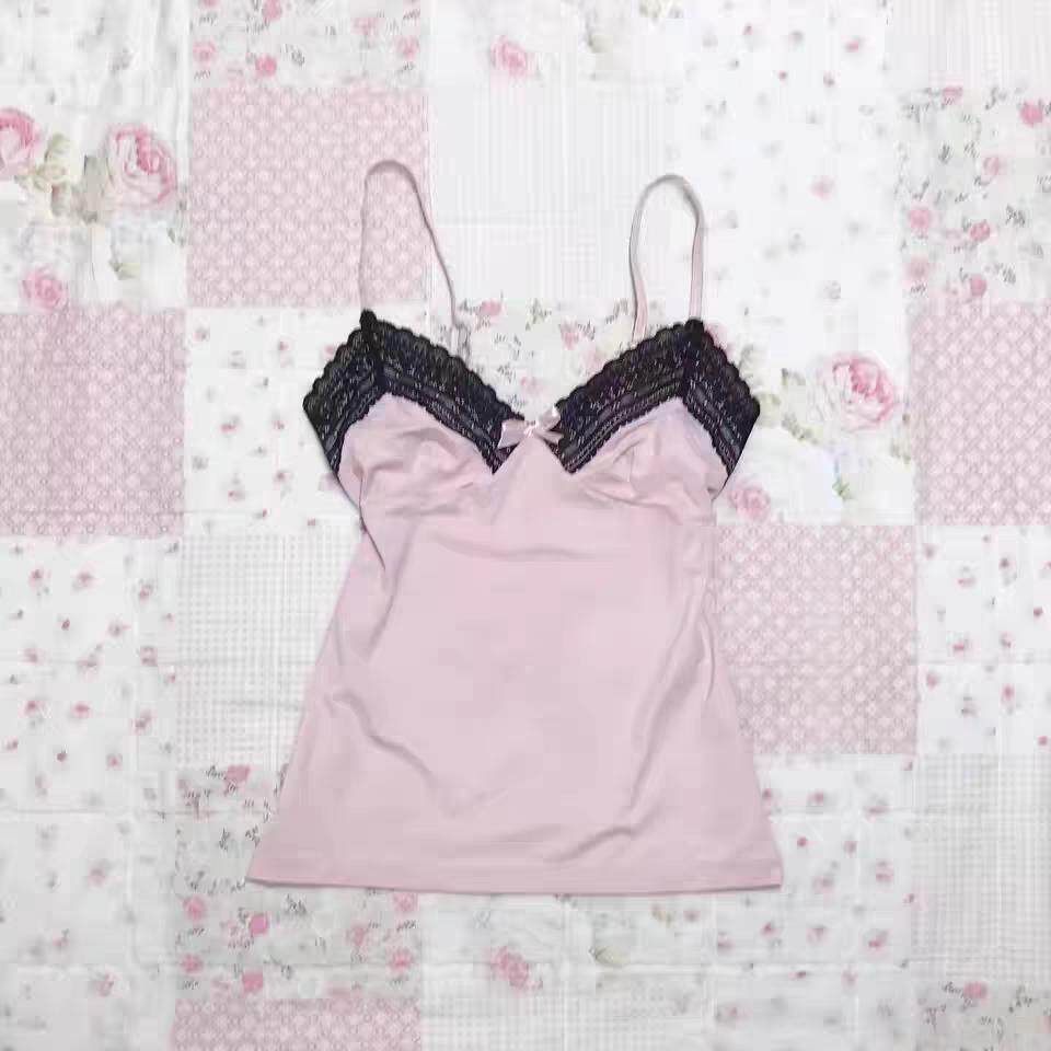 Light pink camisole with black lace-trim cups and thin spaghetti straps