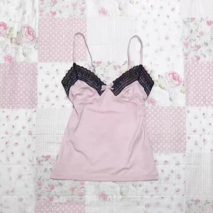 Light pink camisole with black lace-trim cups and thin spaghetti straps