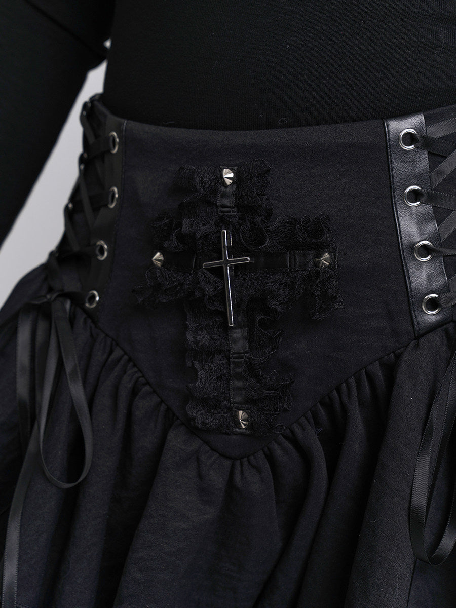 Black corset-style skirt panel with metal grommets, cross emblem, and lace trim
