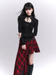 Black long-sleeved fitted top with ruched waist, button front, and keyhole neckline