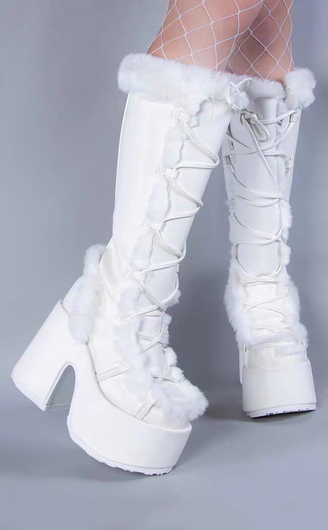 White platform ankle boots with lace-up front and fluffy faux-fur trim