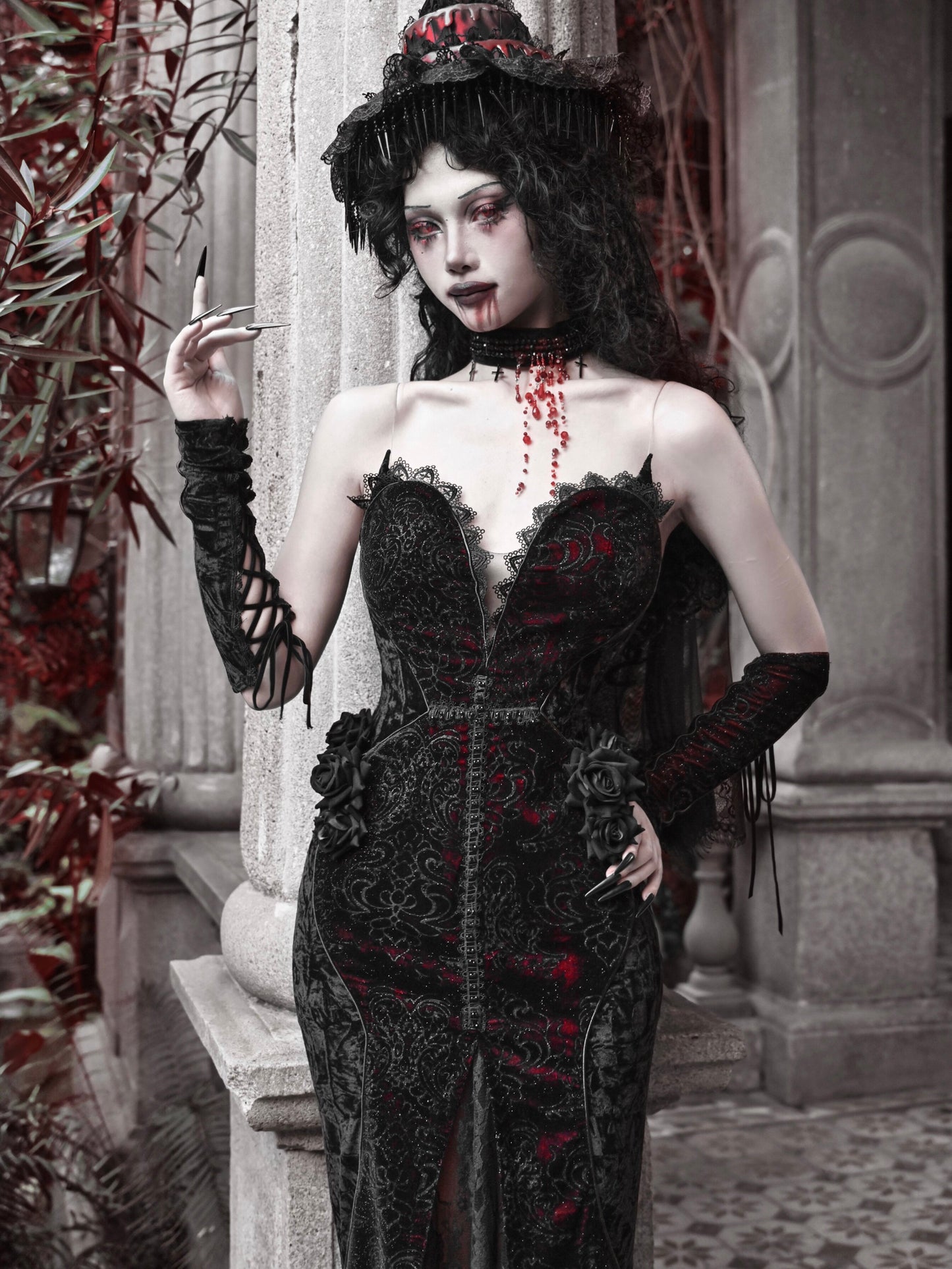 Black gothic corset maxi dress with red embroidery, sweetheart neckline, lace rosette details.