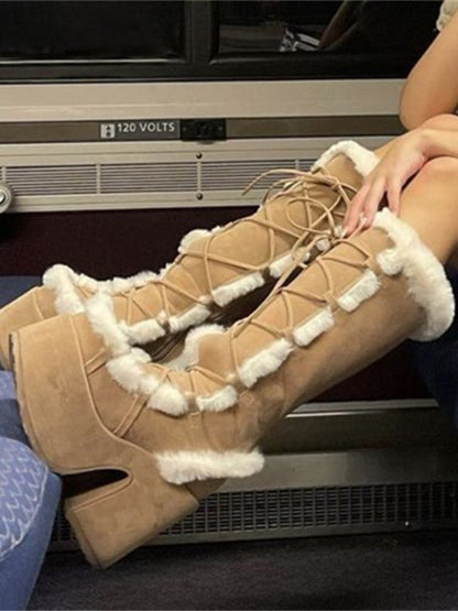 Tan platform ankle boots with lace-up front and white faux-fur trim