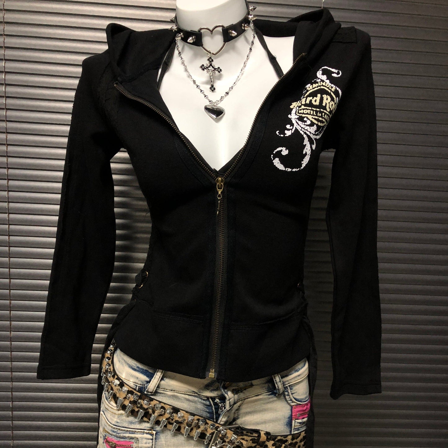 Black zip-up hooded sweatshirt jacket with chest graphic and front pockets
