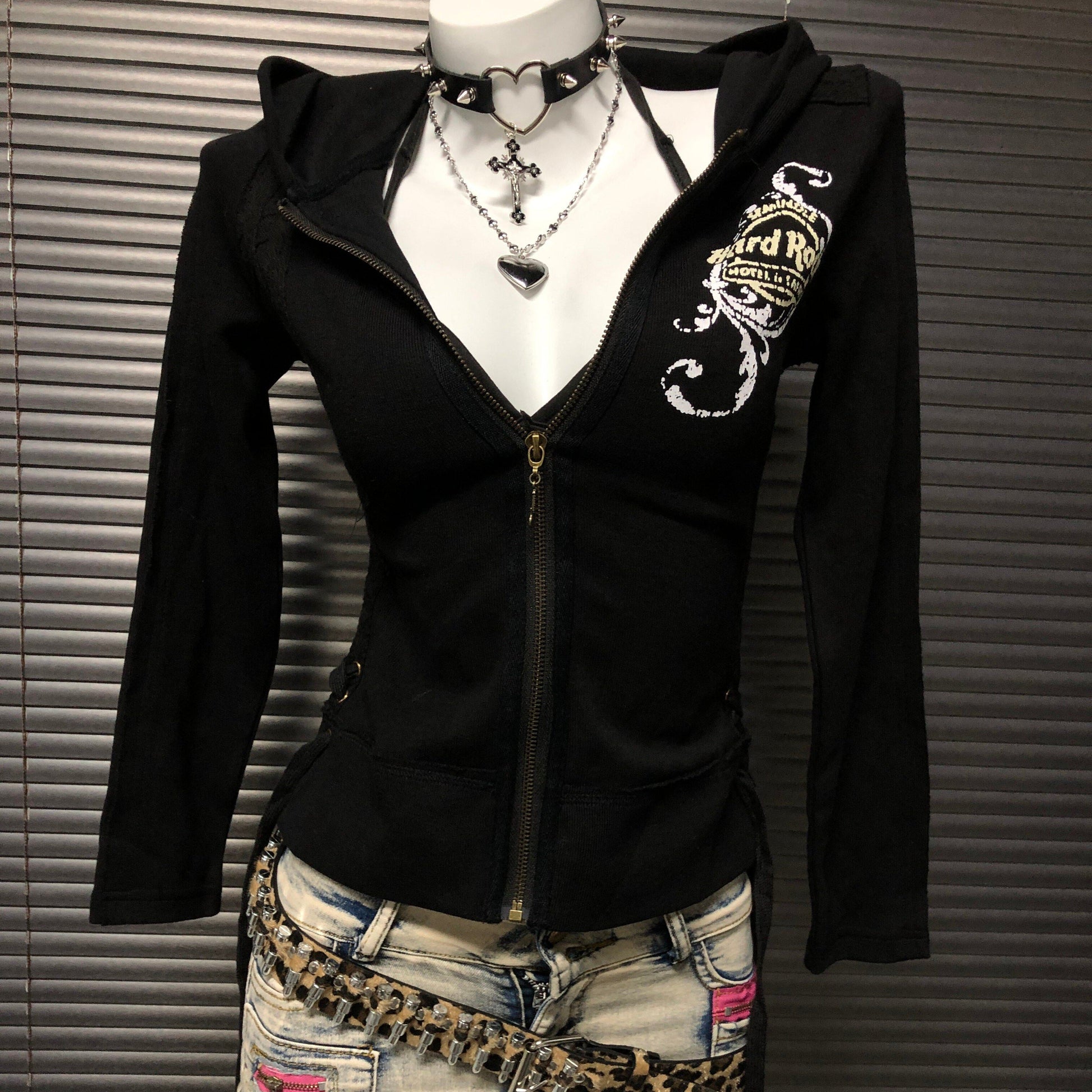 Black zip-up hooded sweatshirt jacket with chest graphic and front pockets