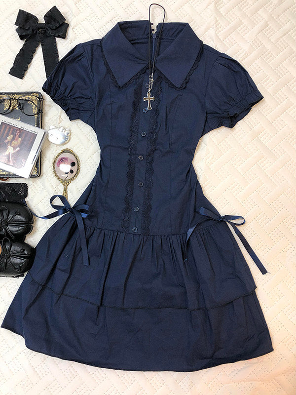 Dark blue lace patchwork dress with short puff sleeves, button front, and tiered skirt.