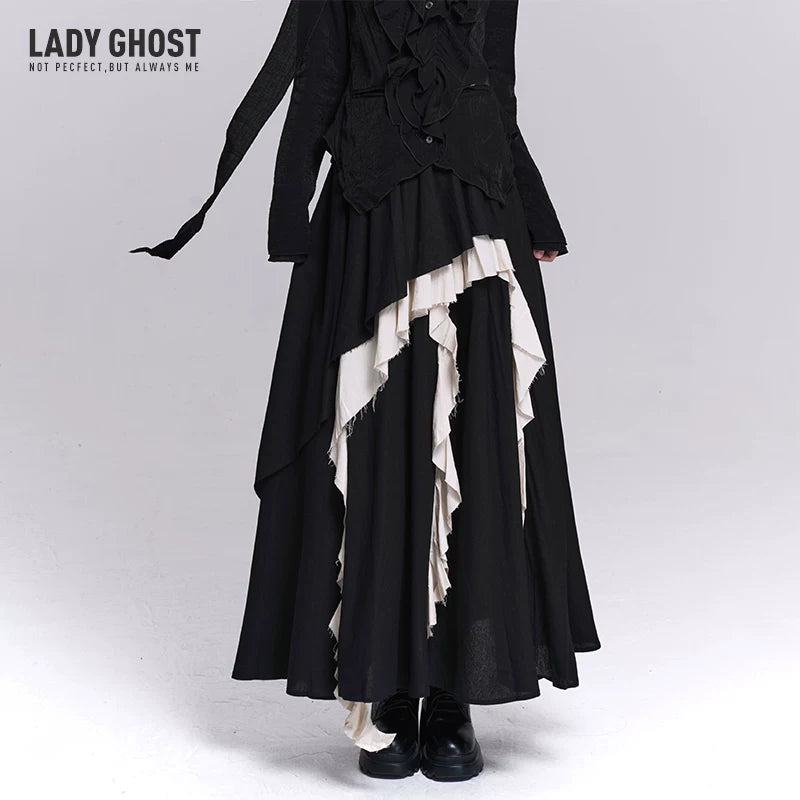 Black maxi skirt with asymmetrical draped tiers and white ruffle inserts
