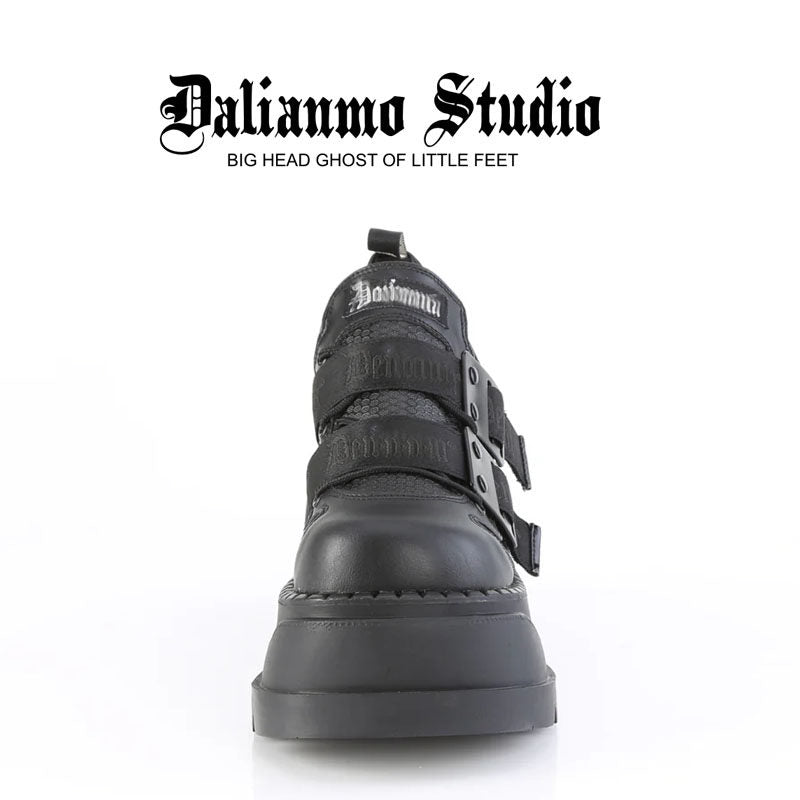 Black platform shoes with double buckle strap detail and tall chunky heel sole