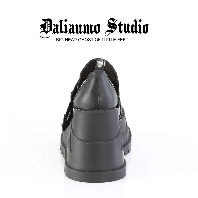 Black platform shoes rear view with thick sole and double strap hardware detail