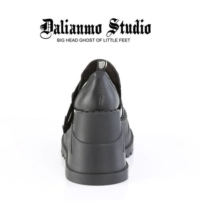 Black platform shoes rear view with thick sole and double strap hardware detail