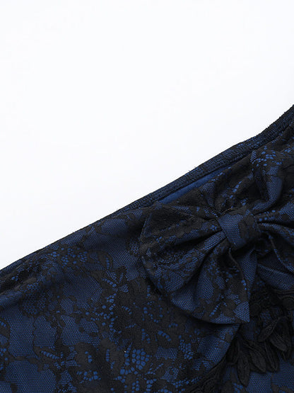 Off-shoulder jacquard top with bow at neckline and black tassel trim