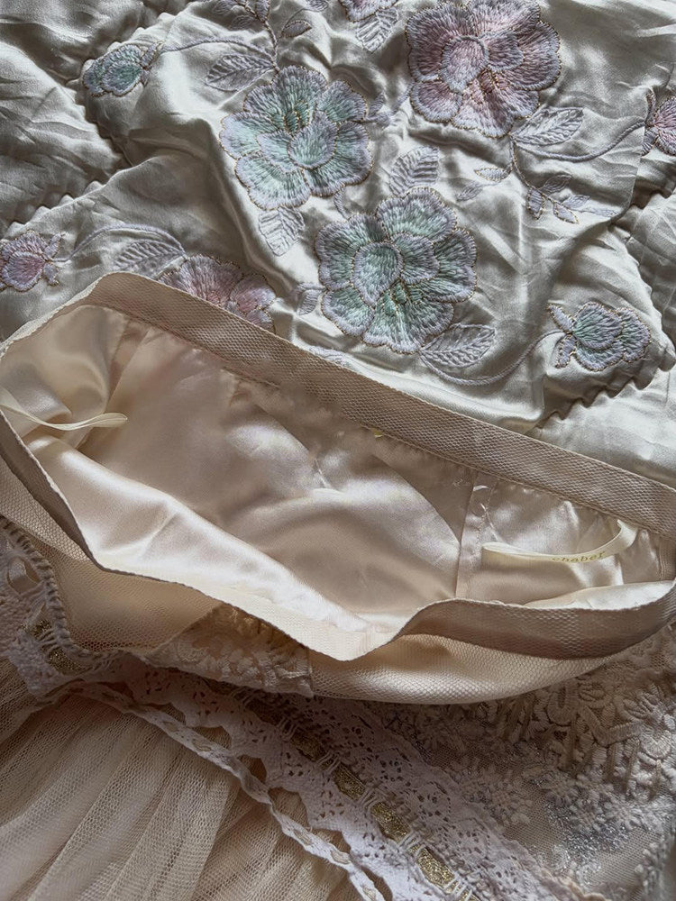 Apricot tulle midi skirt with pastel floral embroidery and wide satin waistband band