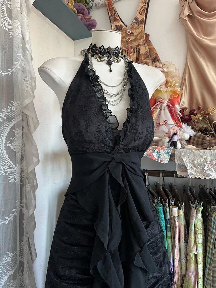 Black halterneck lace dress with bow front and layered ruffle skirt