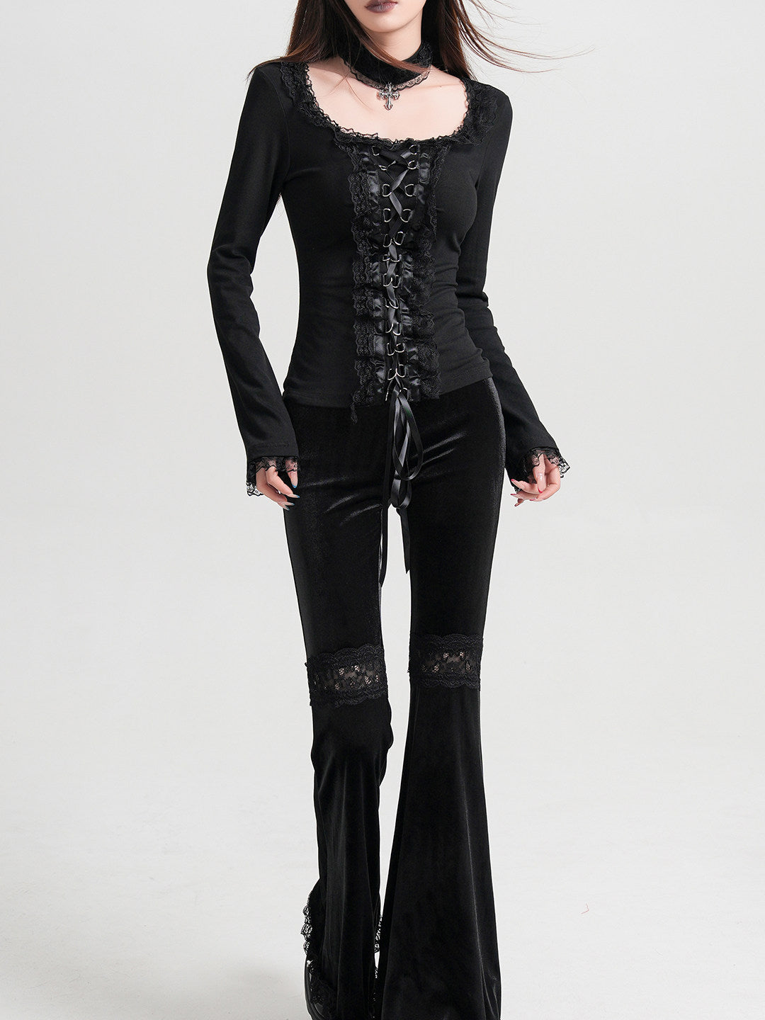 Black long-sleeve gothic top with lace neckline trim and vertical front corset lacing
